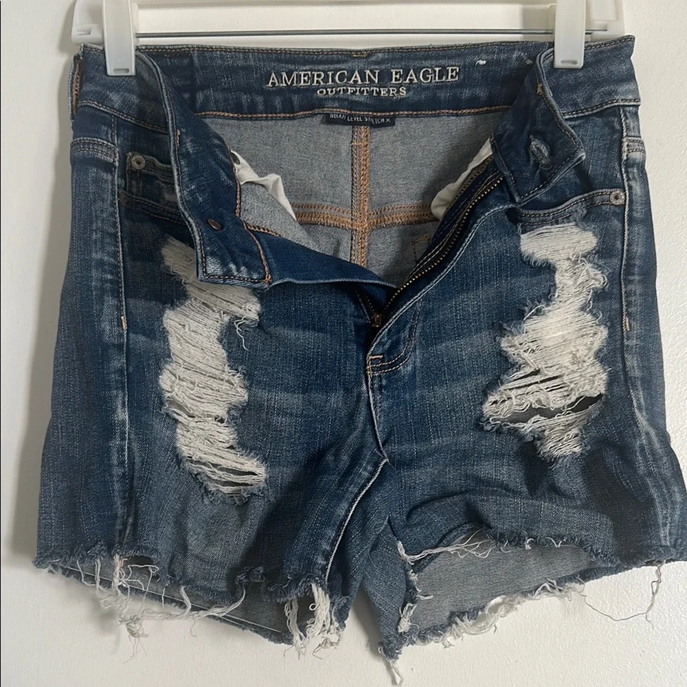 EUC American Eagle Next Level Stretch Blue Distressed Jean Shorts with Raw Hem - Picture 1 of 5